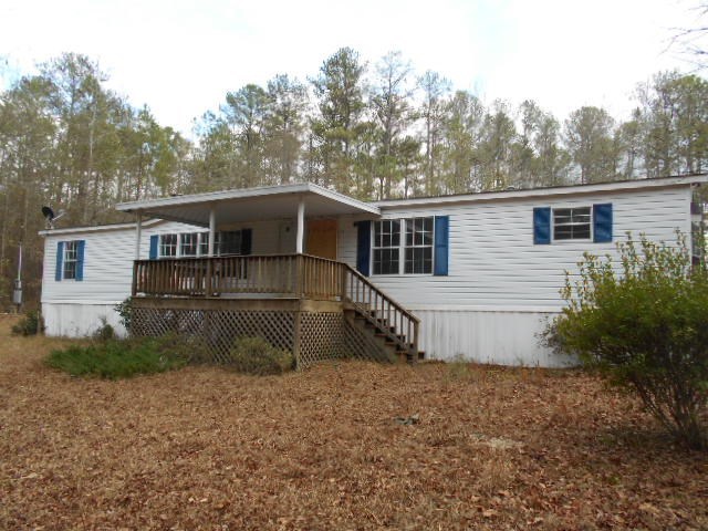 5654 Fulton Mill Road Lizella, GA 31052 - Photo 3 of 12 a house view with a backyard space