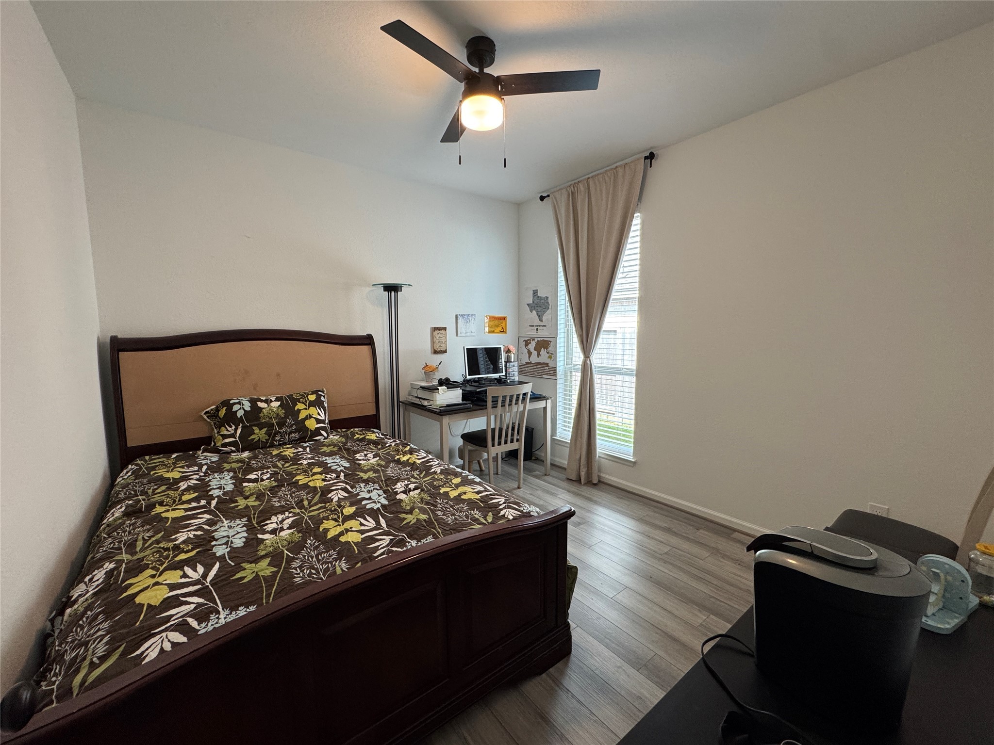 4522 Peloton Road Rosharon, TX 77583 - Photo 15 of 19 a bedroom with a bed a dresser and potted plants