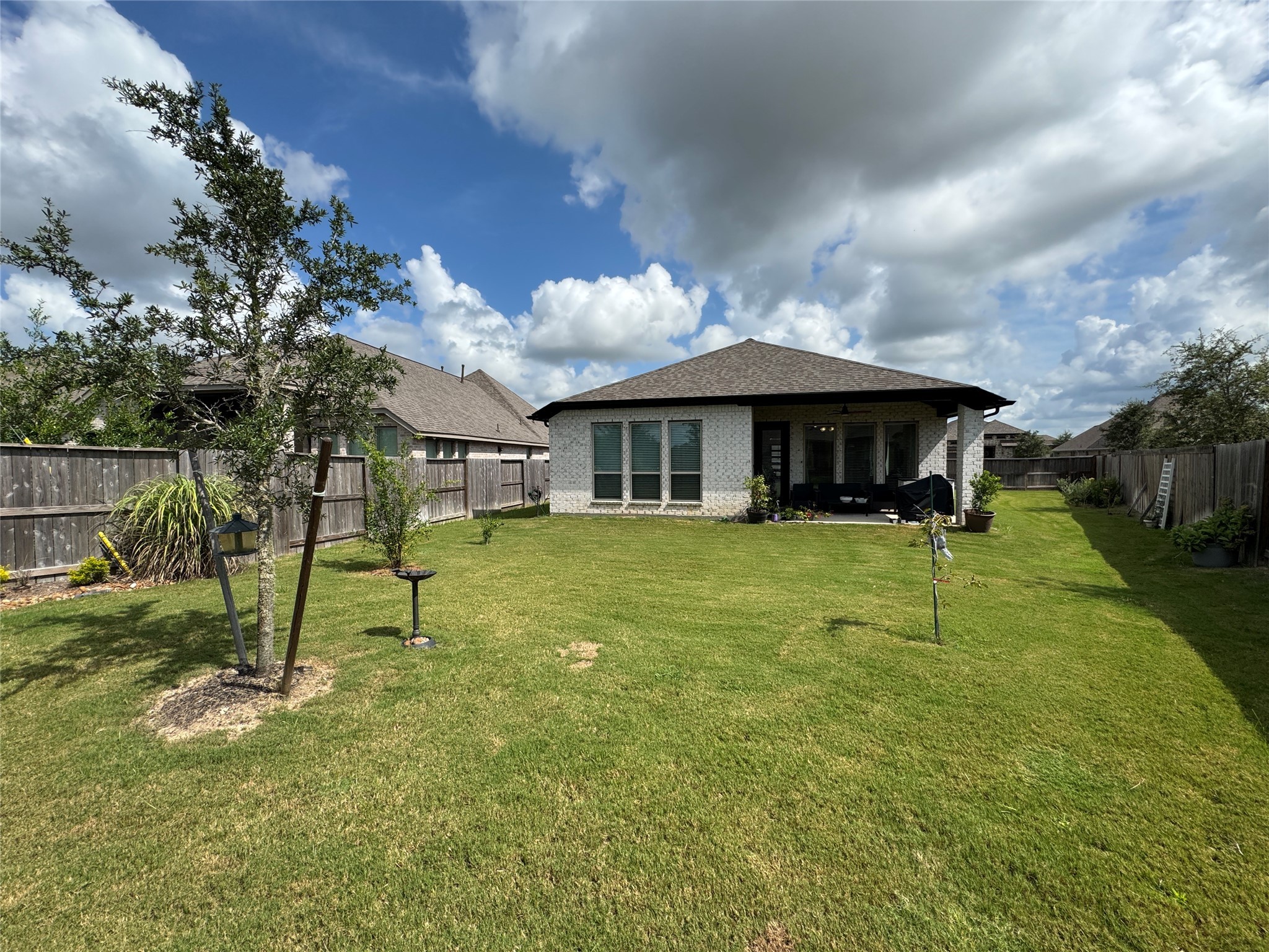 4522 Peloton Road Rosharon, TX 77583 - Photo 17 of 19 a view of a house with a yard