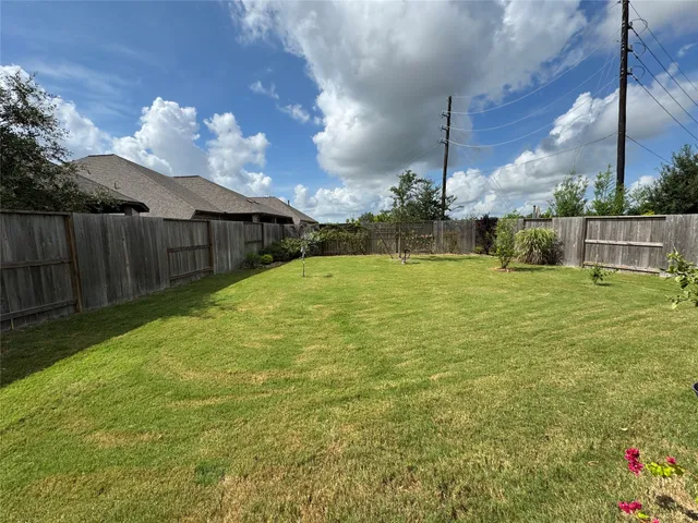 a view of a backyard of the house