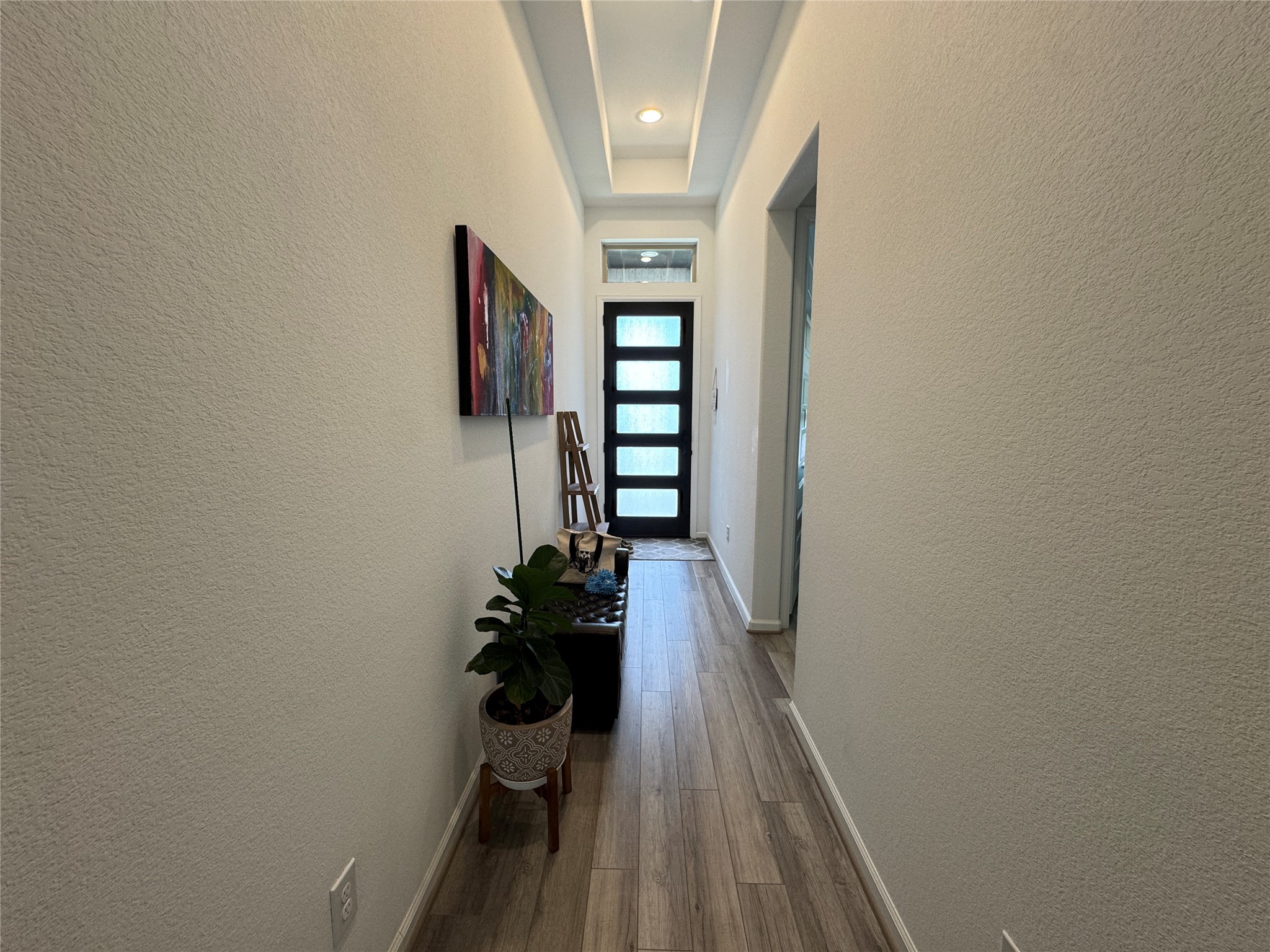 4522 Peloton Road Rosharon, TX 77583 - Photo 5 of 19 a view of a hallway with wooden floor and staircase