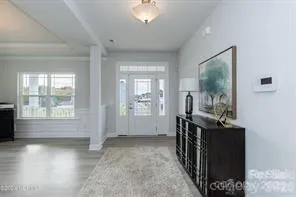 a view of livingroom with furniture wooden floor and windows