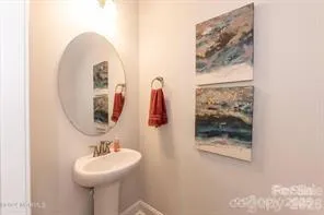 a bathroom with a sink and mirror