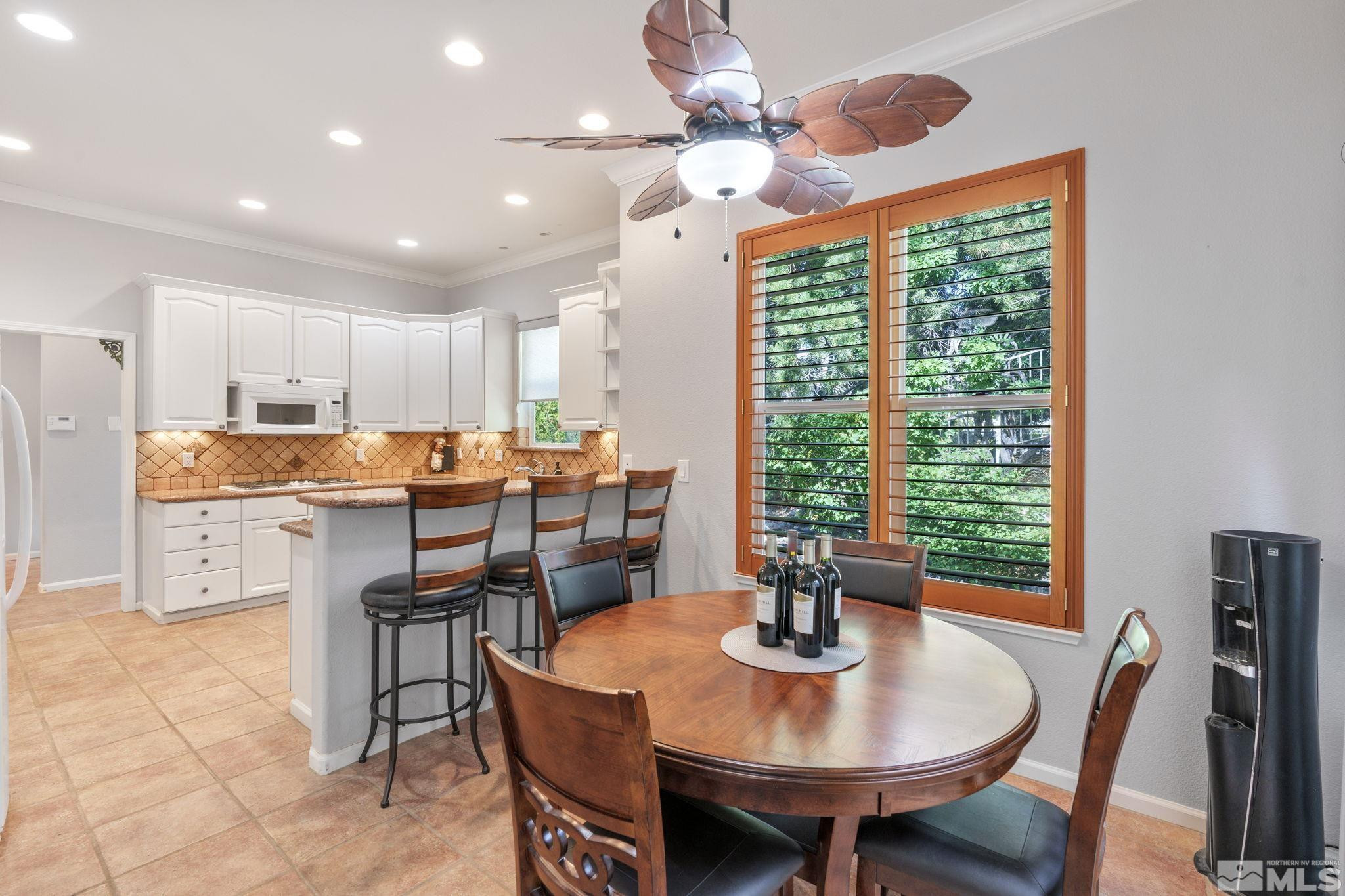 3950 Plateau Road Reno, NV 89519 - Photo 15 of 37 a view of a dining room with furniture window and outside view