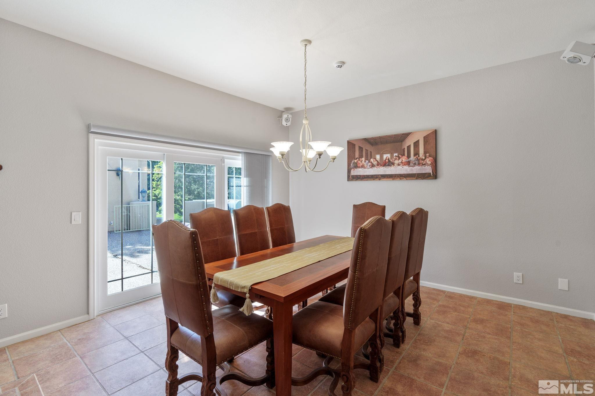 3950 Plateau Road Reno, NV 89519 - Photo 16 of 37 a view of a dining room with furniture window and outside view