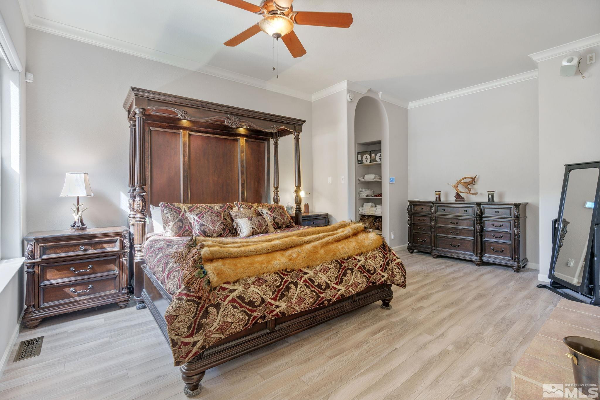3950 Plateau Road Reno, NV 89519 - Photo 19 of 37 a bedroom with a bed and a television