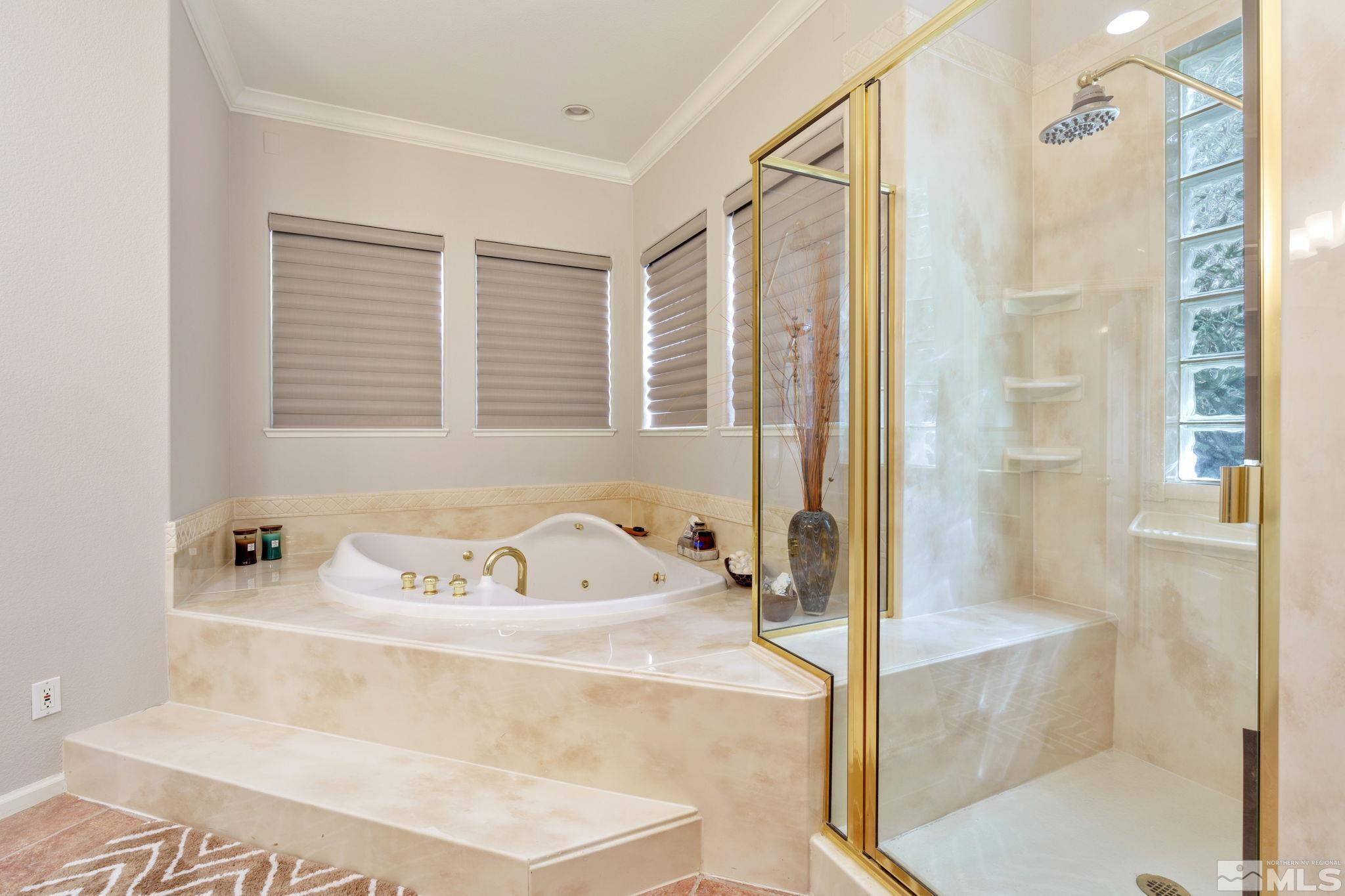 3950 Plateau Road Reno, NV 89519 - Photo 23 of 37 a bathroom with a bathtub and a shower