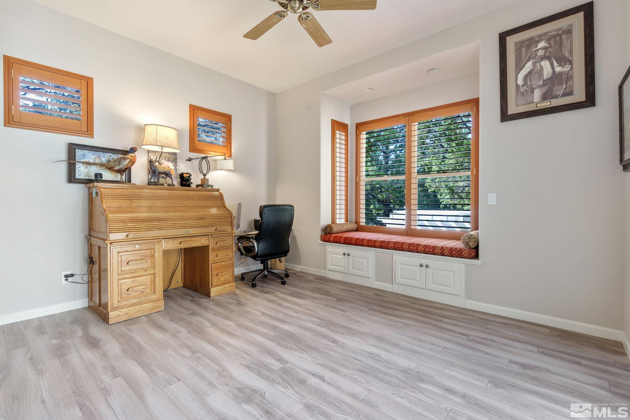 3950 Plateau Road Reno, NV 89519 - Photo 26 of 37 a view of a workspace with furniture and a window