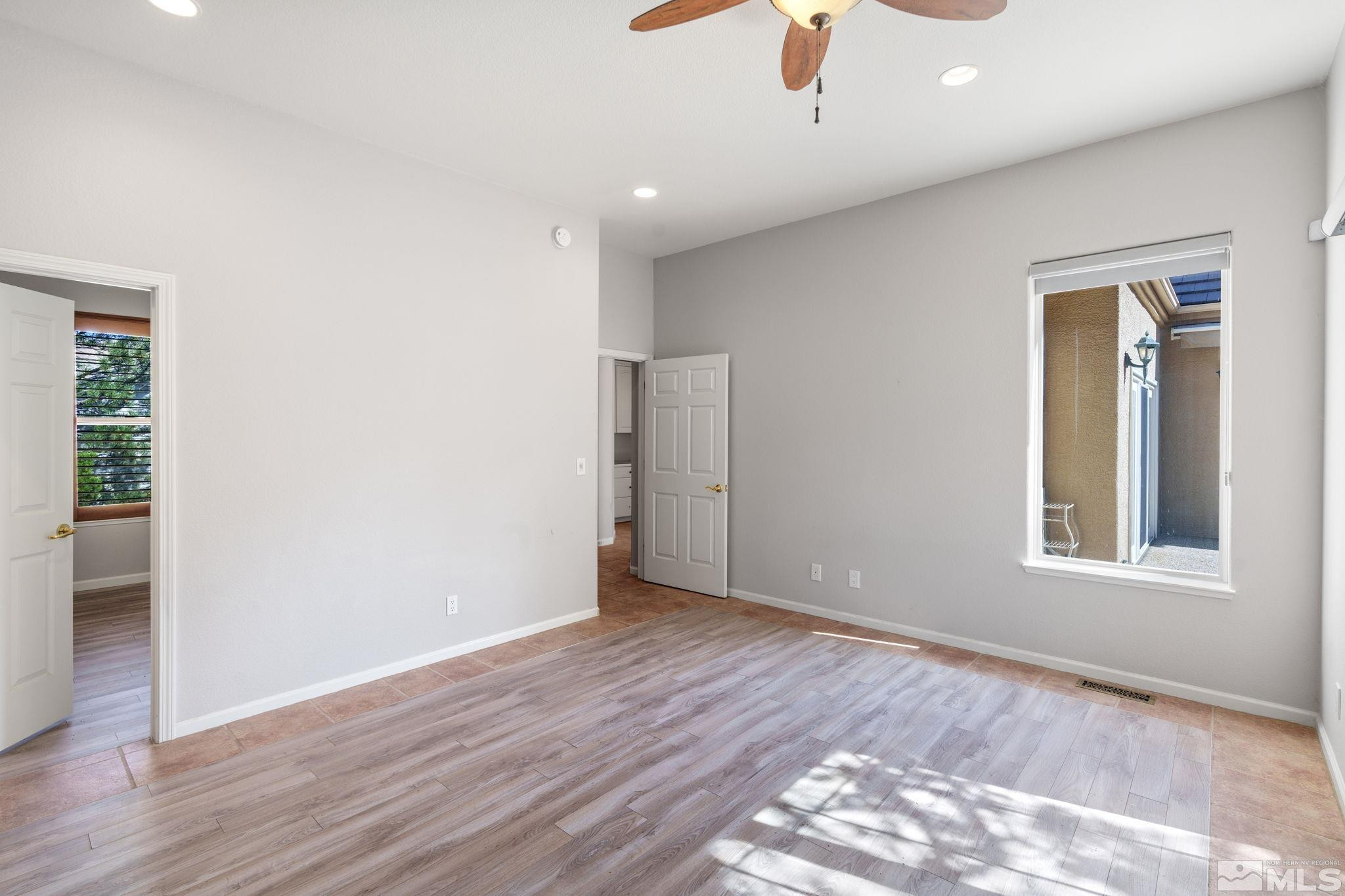 3950 Plateau Road Reno, NV 89519 - Photo 29 of 37 wooden floor in an empty room with a window
