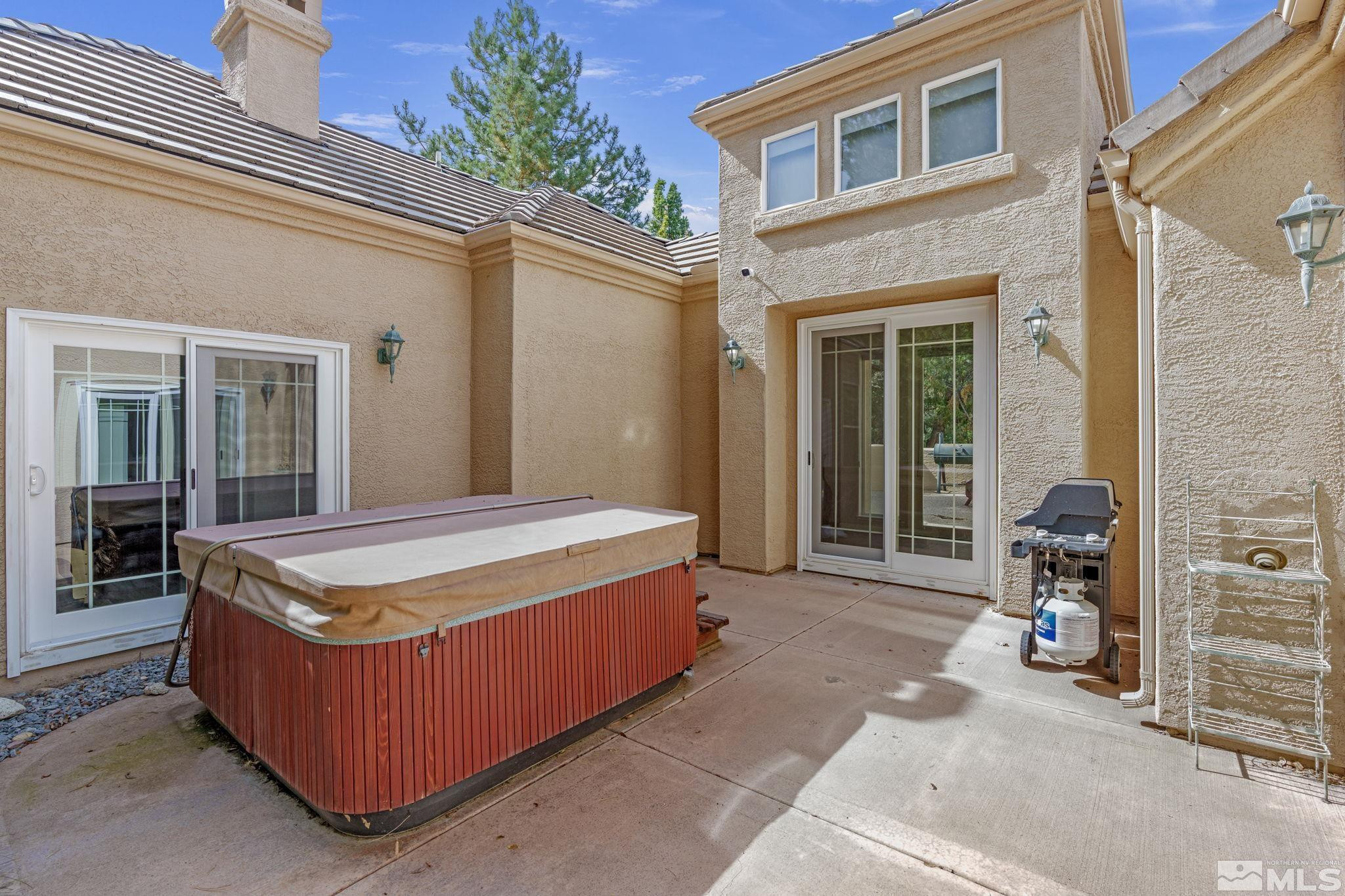 3950 Plateau Road Reno, NV 89519 - Photo 35 of 37 a building with a table and chairs in patio