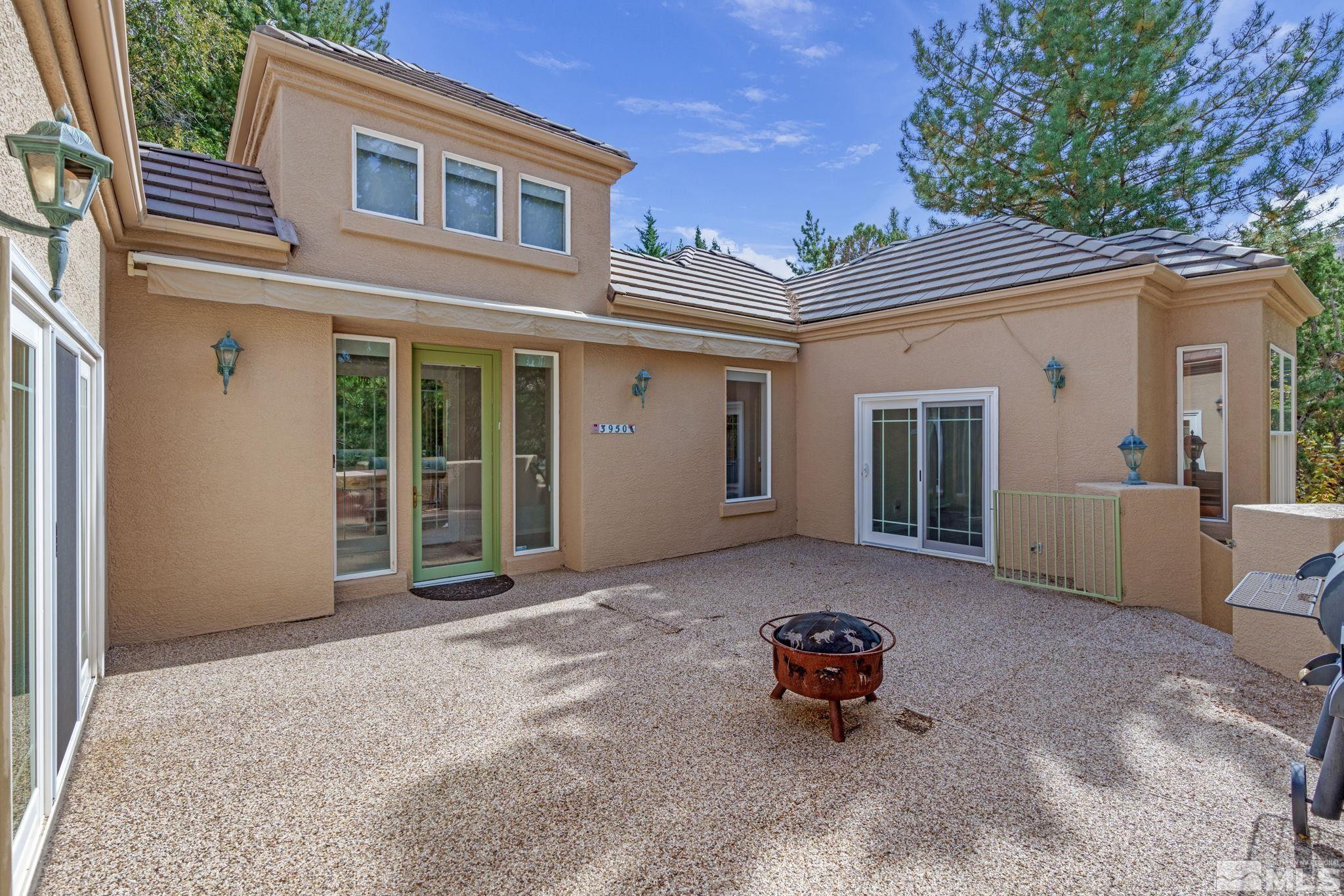 3950 Plateau Road Reno, NV 89519 - Photo 5 of 37 a backyard of a house with outdoor seating