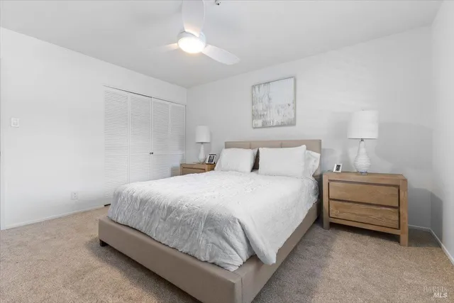 a bedroom with a bed and a dresser