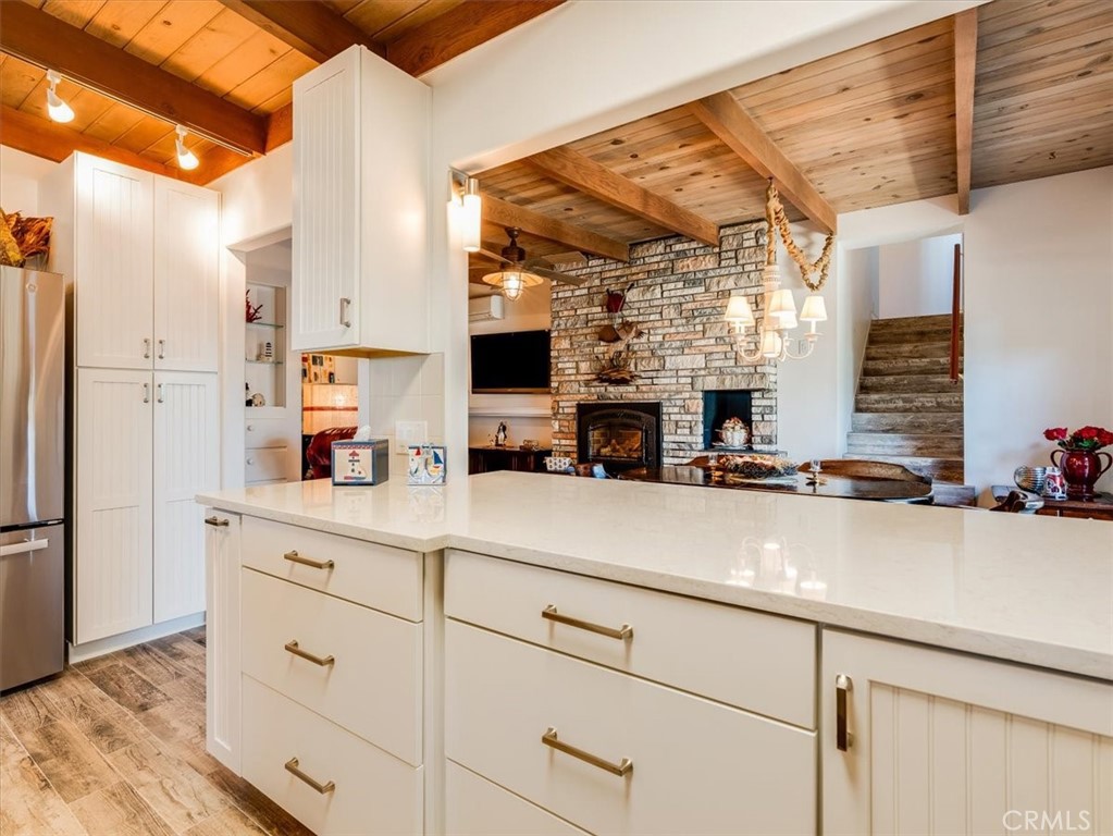 430 Olive Street Morro Bay, CA 93442 - Photo 21 of 68 a kitchen with stainless steel appliances a sink and a refrigerator
