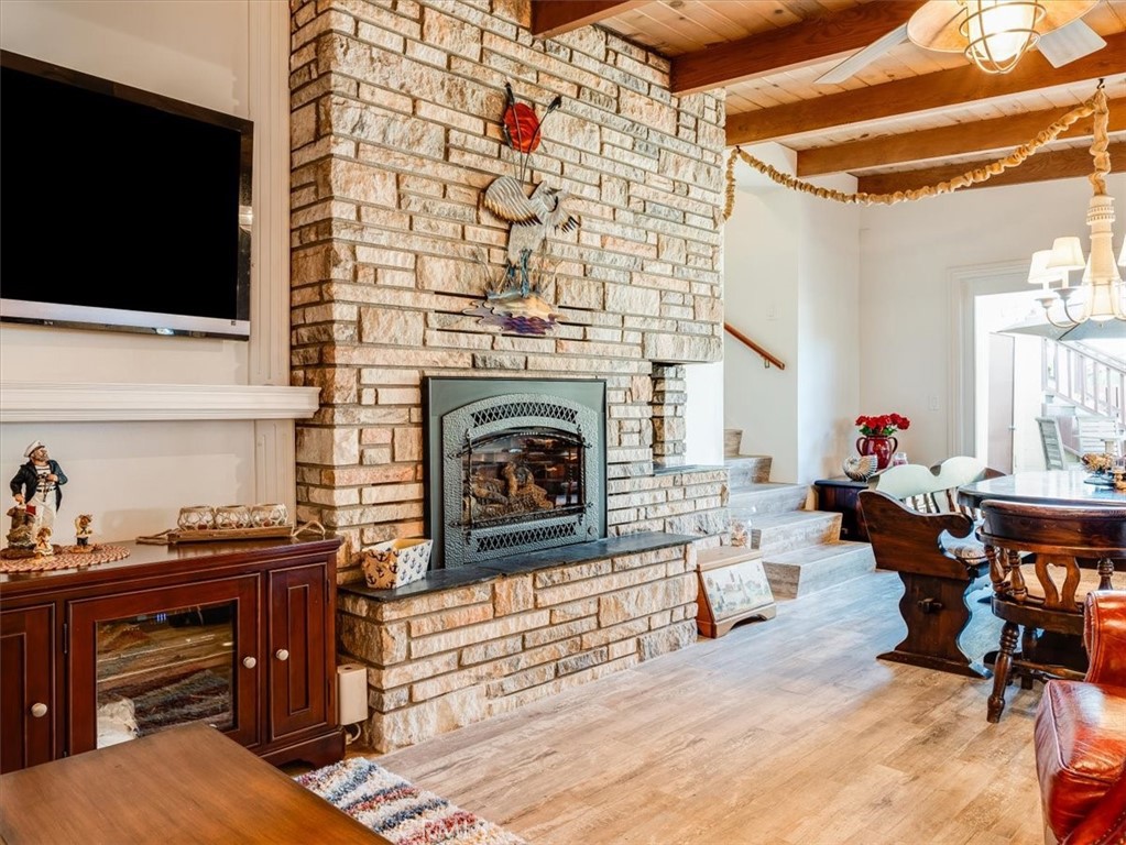 430 Olive Street Morro Bay, CA 93442 - Photo 29 of 68 a living room with furniture flat screen tv and a fireplace