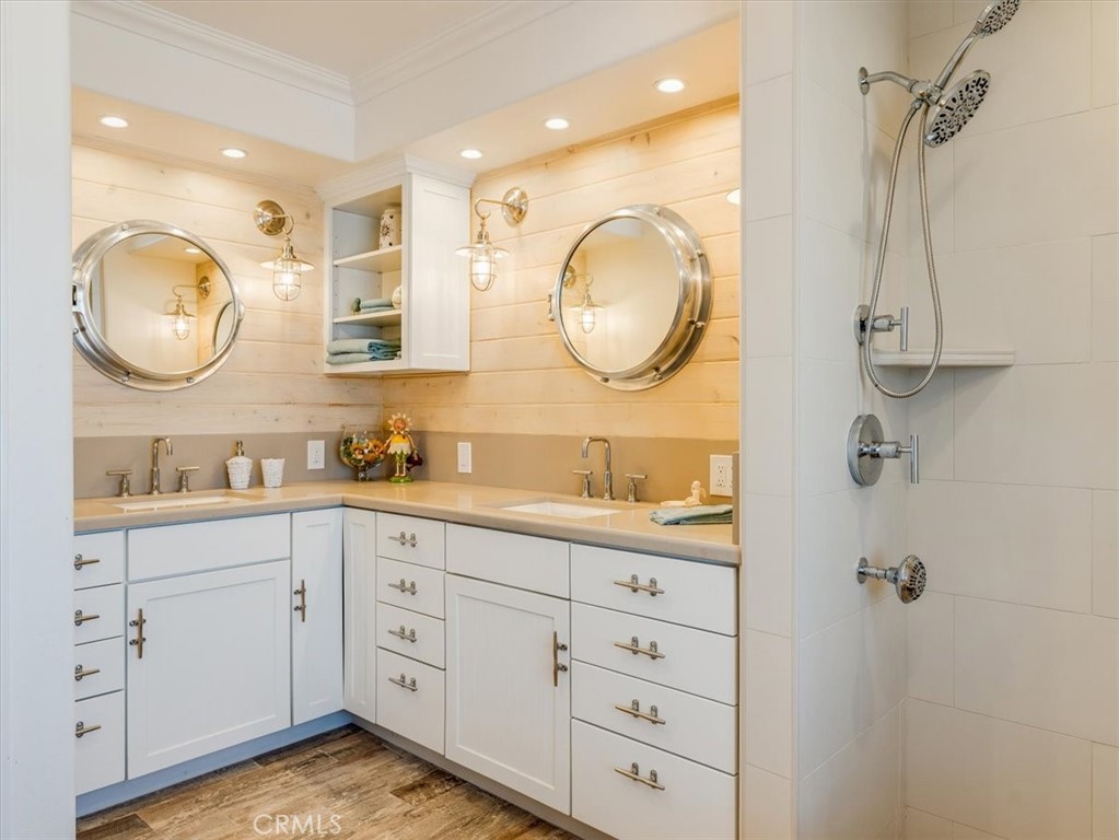 430 Olive Street Morro Bay, CA 93442 - Photo 41 of 68 a spacious bathroom with a granite countertop sink mirror and vanity