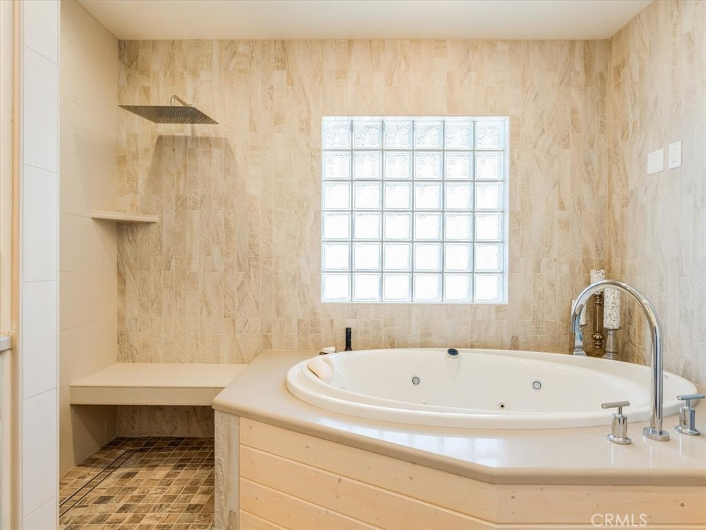 430 Olive Street Morro Bay, CA 93442 - Photo 42 of 68 a bathroom with a bathtub and a window