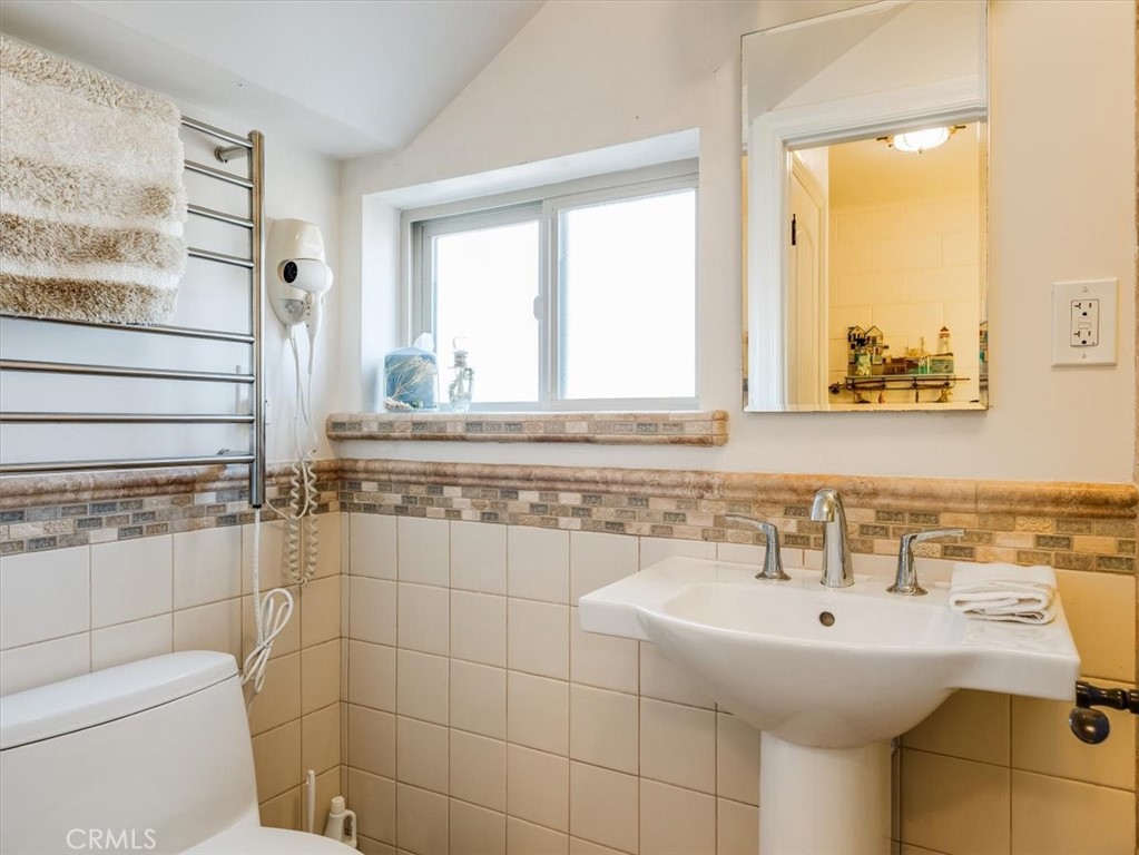 430 Olive Street Morro Bay, CA 93442 - Photo 45 of 68 a bathroom with a sink a toilet and a shower