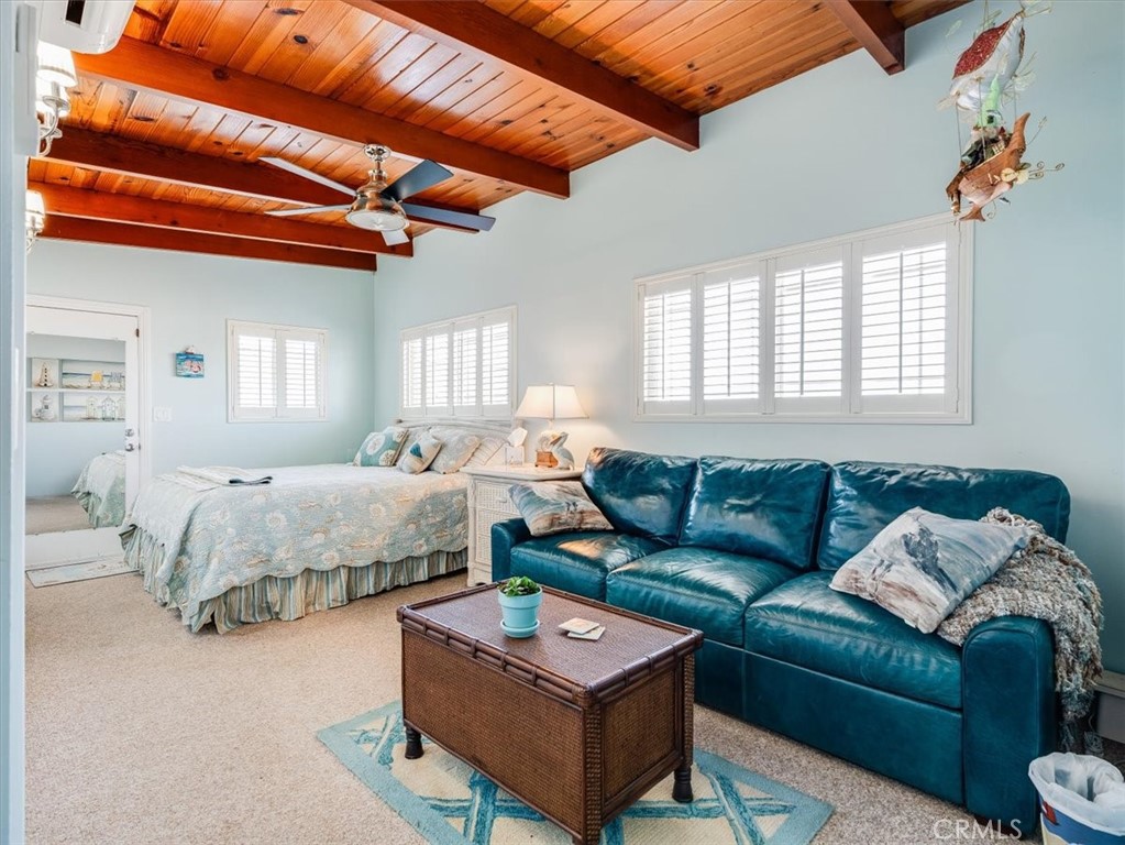 430 Olive Street Morro Bay, CA 93442 - Photo 47 of 68 a bedroom with furniture and a large window