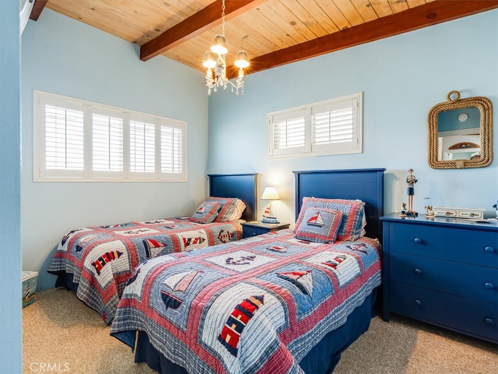 430 Olive Street Morro Bay, CA 93442 - Photo 49 of 68 a bedroom with two beds and a window
