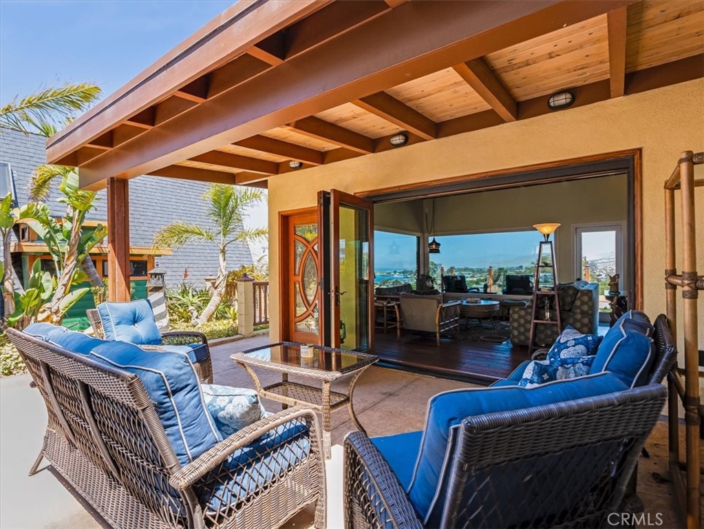 430 Olive Street Morro Bay, CA 93442 - Photo 52 of 68 a living room with furniture and a large window