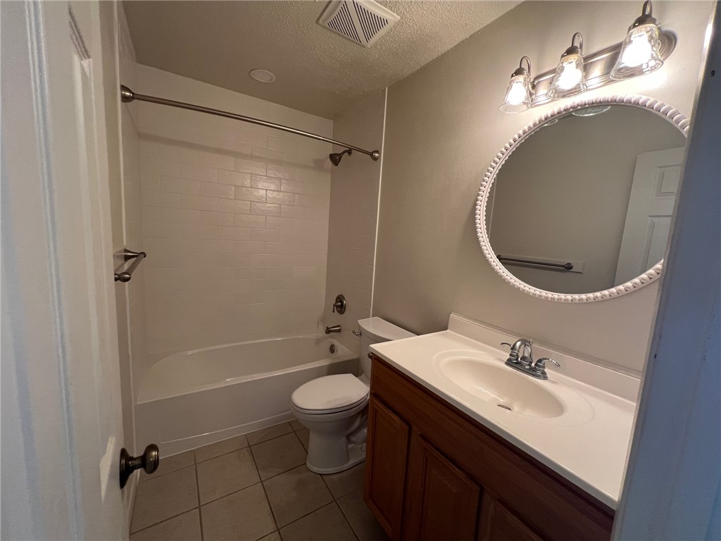 808 Natalie Street, Unit A Bryan, TX 77801 - Photo 5 of 8 a bathroom with a sink toilet and shower