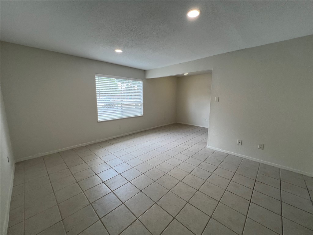 808 Natalie Street, Unit A Bryan, TX 77801 - Photo 6 of 8 an empty room with windows