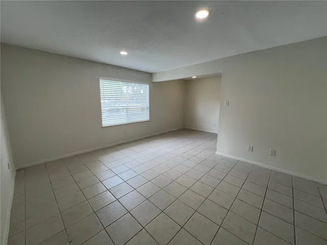 a kitchen with a sink a stove and a refrigerator
