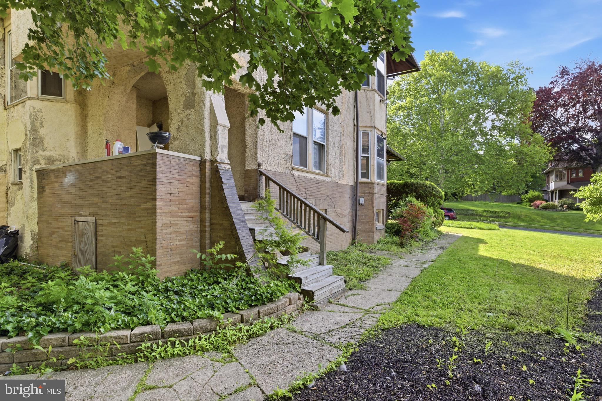 5939 Drexel Road, Unit 1 Philadelphia, PA 19131 - Photo 11 of 16 a view of a large garden with plants and large trees