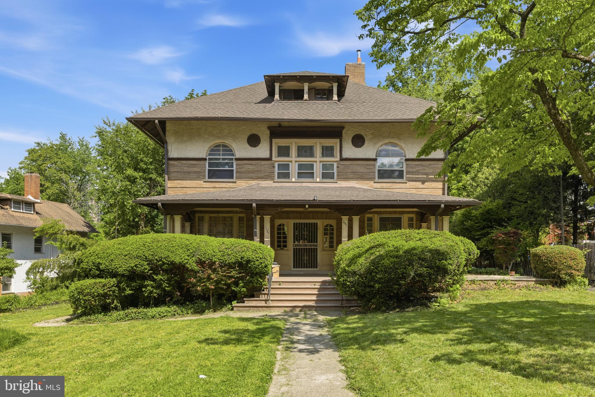 5939 Drexel Road, Unit 1 Philadelphia, PA 19131 - Photo 14 of 16 a front view of a house with a yard