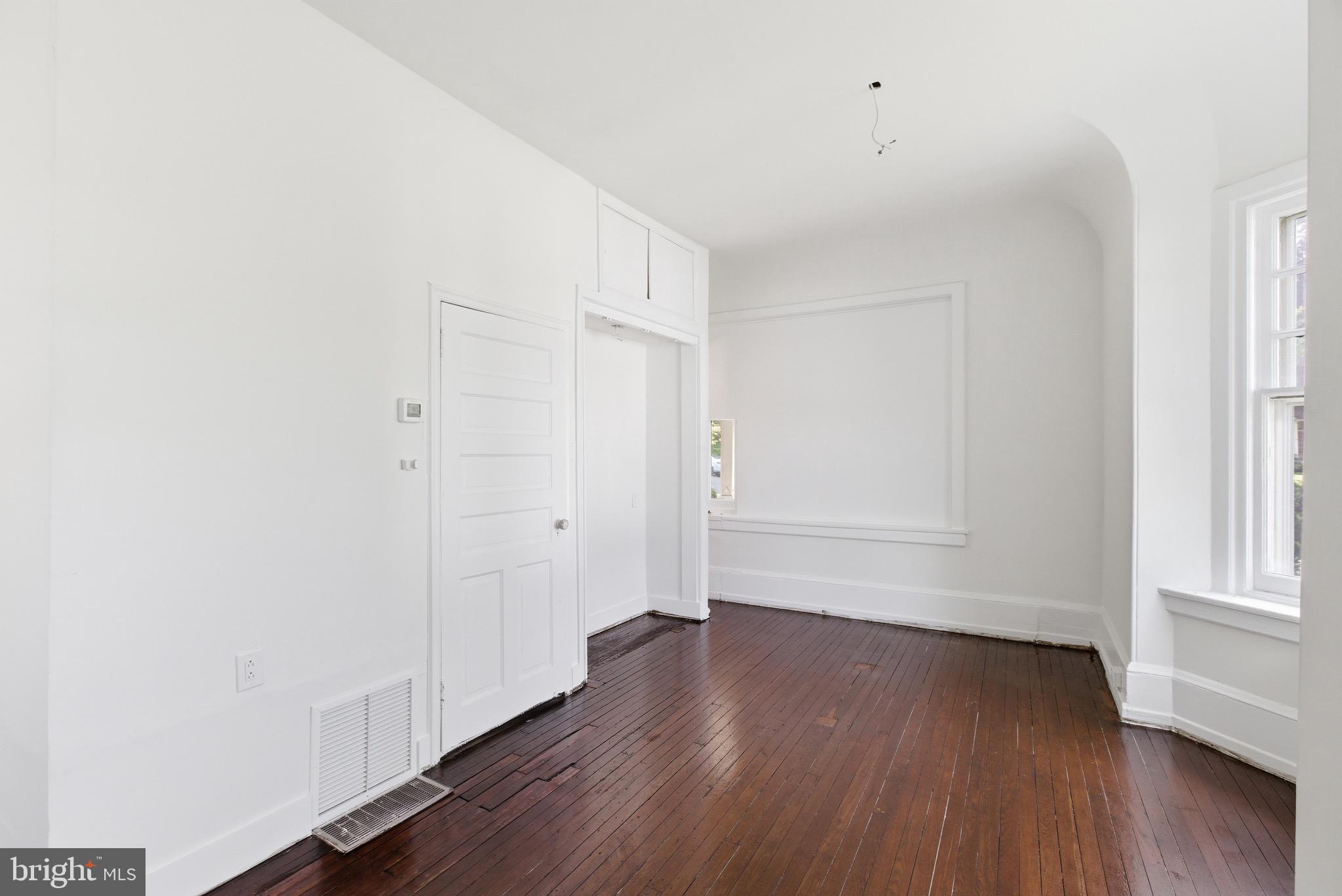 5939 Drexel Road, Unit 1 Philadelphia, PA 19131 - Photo 4 of 16 an empty room with wooden floor