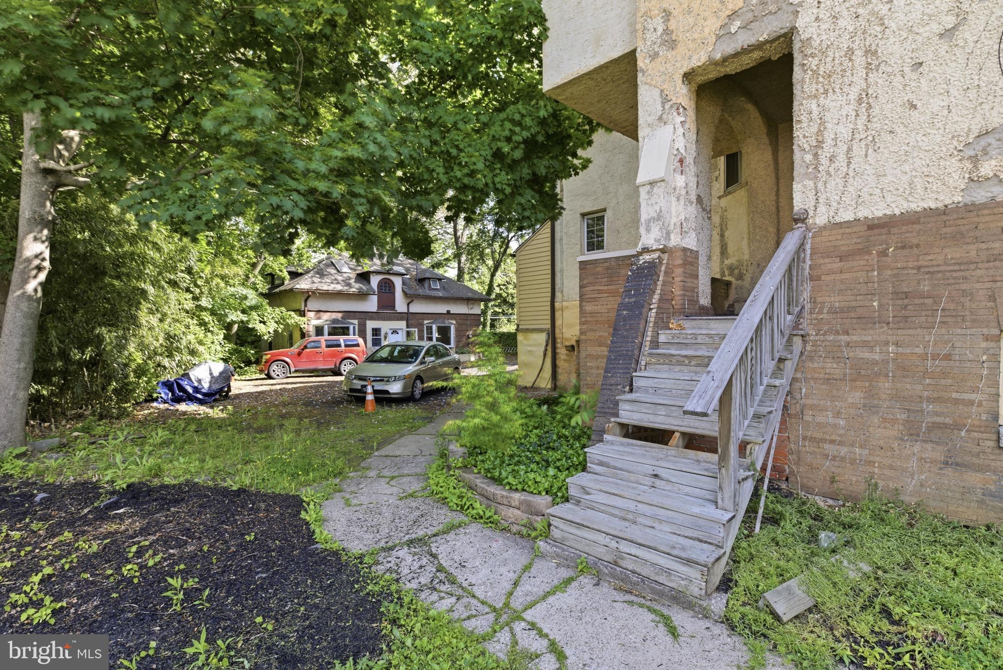 5939 Drexel Road, Unit 1 Philadelphia, PA 19131 - Photo 10 of 16 a view of a house with a yard