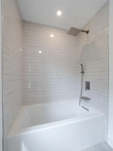 a close up of a bathtub in a bathroom