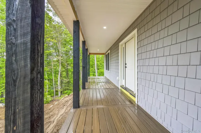 a view of balcony with wooden floor