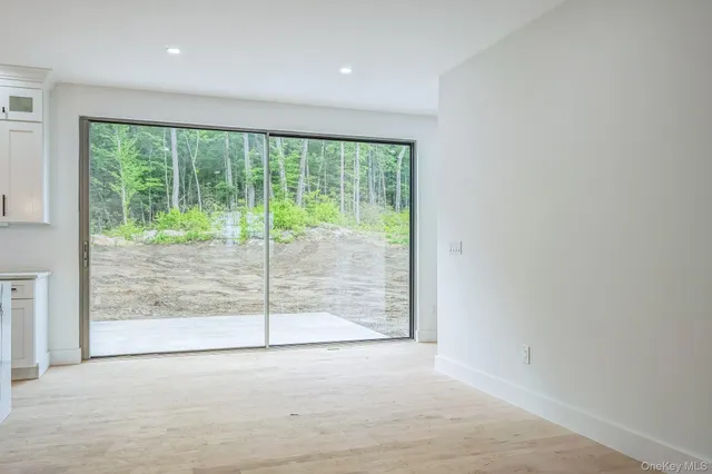 a view of a room with sliding glass door