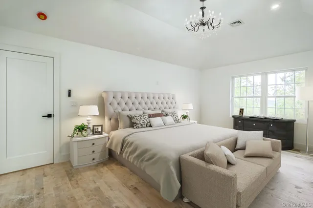 a bedroom with a bed and window