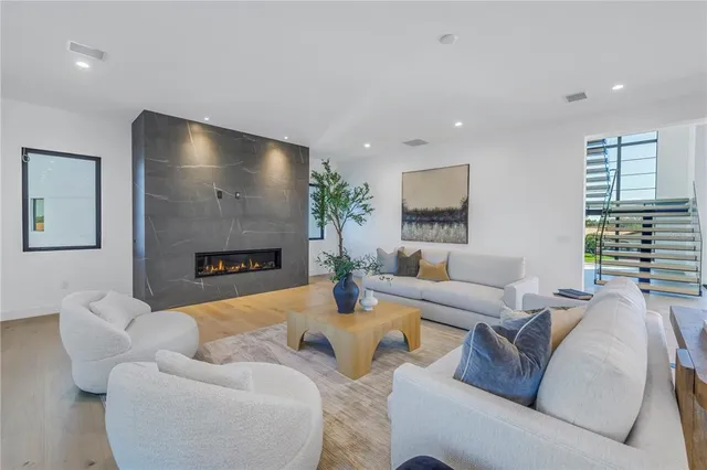 a bathroom with a double vanity sink toilet and shower