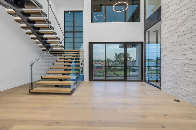 a large kitchen with stainless steel appliances granite countertop a lot of counter space