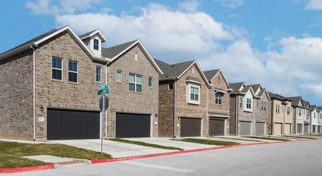 a front view of a house with garage