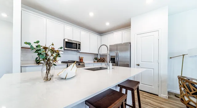 a kitchen with a table and chairs