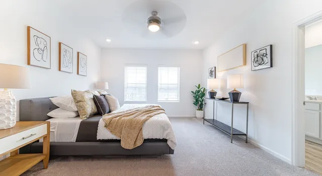 a bed room with a bed and a couch