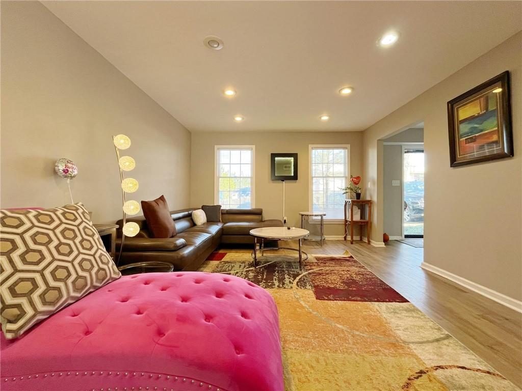 6520 Roswell Road, Unit 3 Atlanta, GA 30328 - Photo 11 of 47 a living room with furniture and wooden floor
