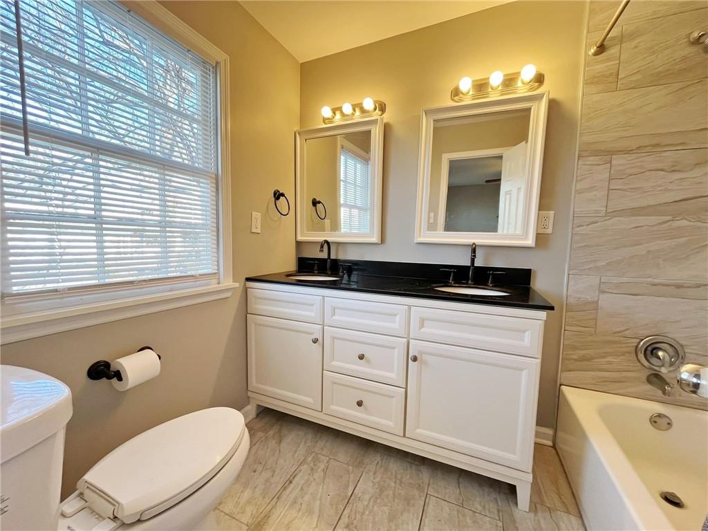 6520 Roswell Road, Unit 3 Atlanta, GA 30328 - Photo 26 of 47 a bathroom with a sink a toilet and bathtub