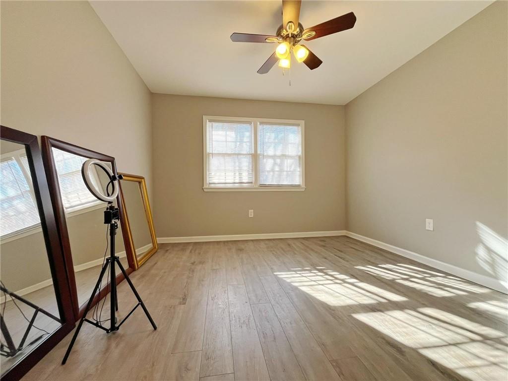 6520 Roswell Road, Unit 3 Atlanta, GA 30328 - Photo 31 of 47 a view of empty room with wooden floor and fan