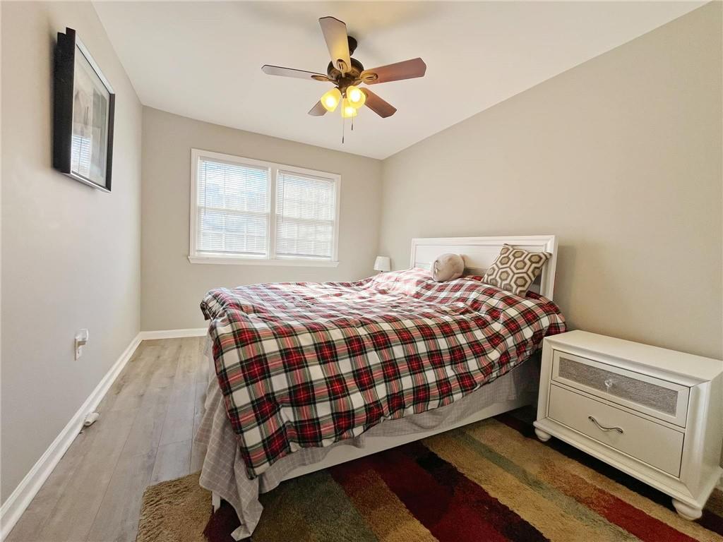 6520 Roswell Road, Unit 3 Atlanta, GA 30328 - Photo 32 of 47 a bedroom with a bed and window