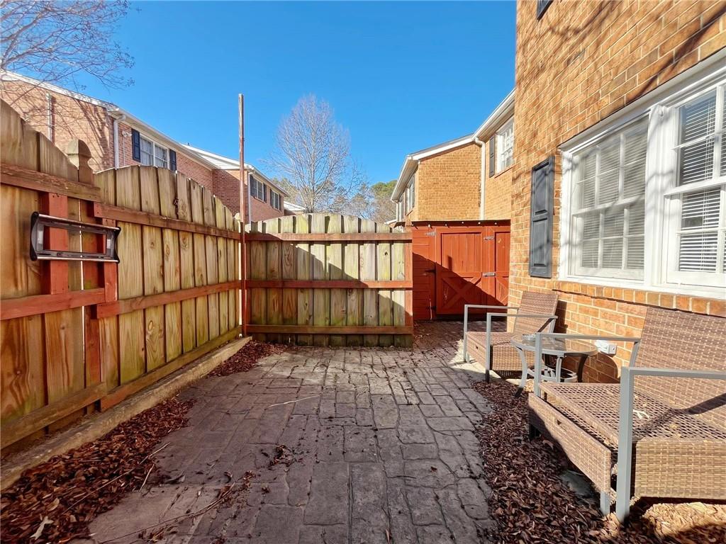 6520 Roswell Road, Unit 3 Atlanta, GA 30328 - Photo 36 of 47 a view of a street with wooden fence