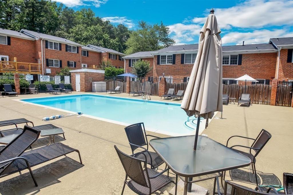6520 Roswell Road, Unit 3 Atlanta, GA 30328 - Photo 43 of 47 a view of a patio with table and chairs and potted plants