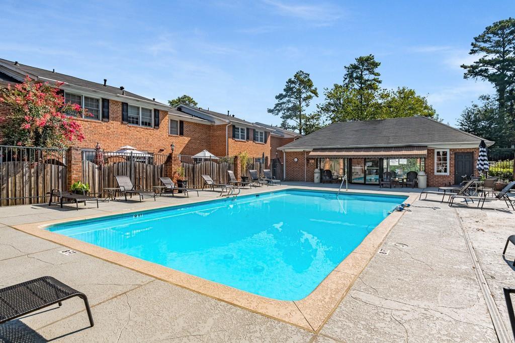 6520 Roswell Road, Unit 3 Atlanta, GA 30328 - Photo 44 of 47 a view of house with swimming pool outdoor seating