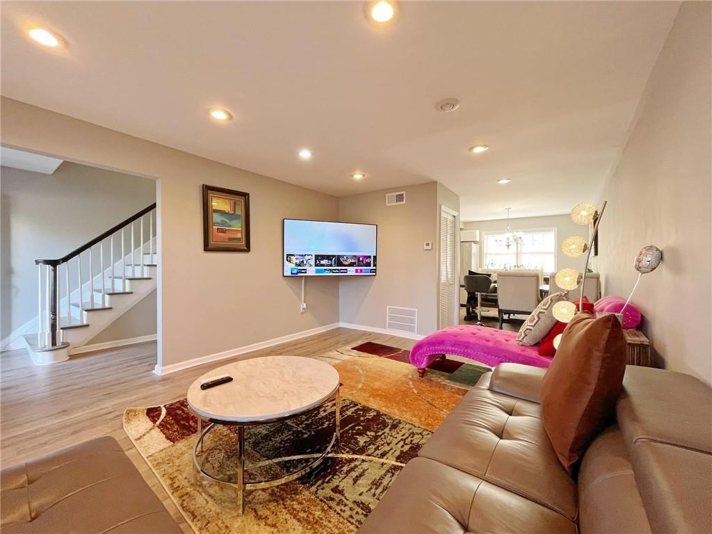 6520 Roswell Road, Unit 3 Atlanta, GA 30328 - Photo 7 of 47 a living room with furniture and a flat screen tv