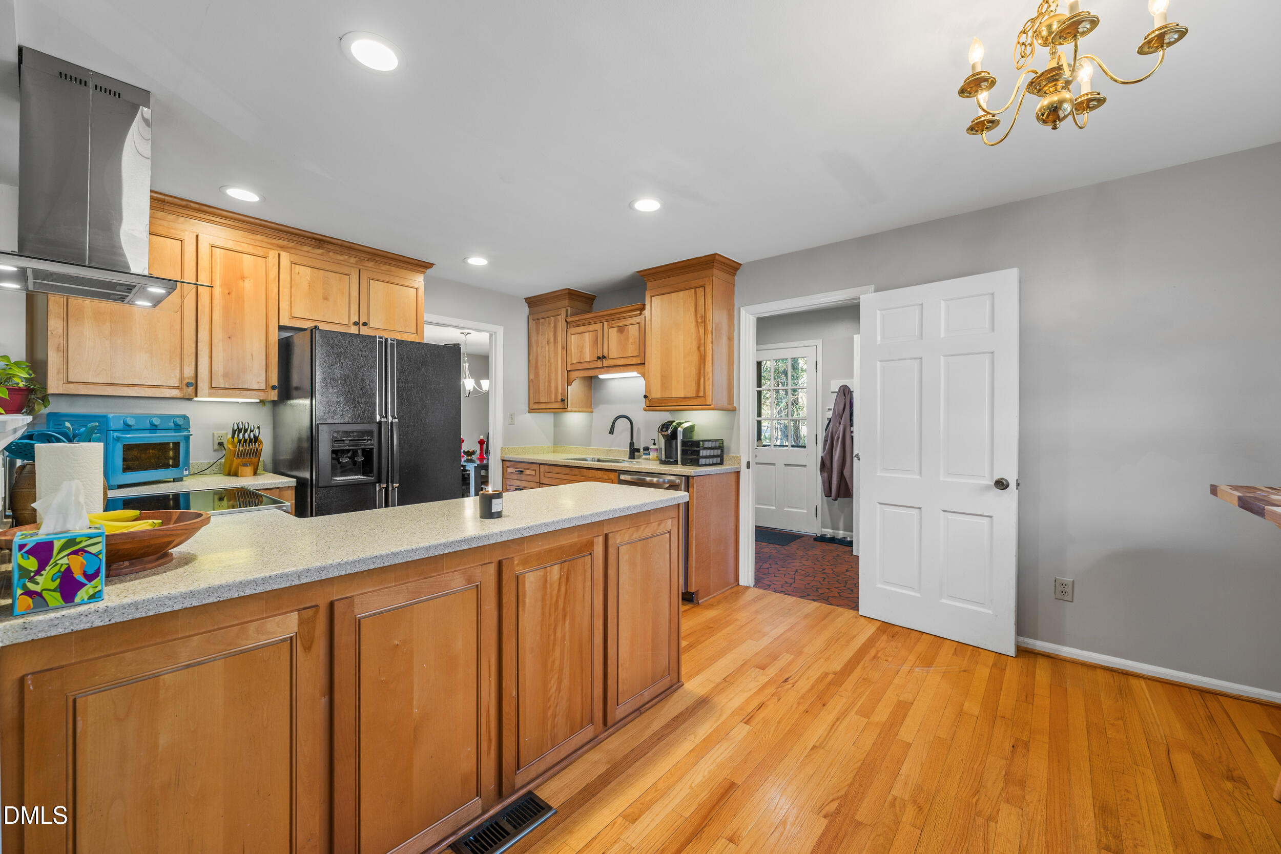3726 Swift Drive Raleigh, NC 27606 - Photo 11 of 40 a kitchen with stainless steel appliances a refrigerator and a stove top oven