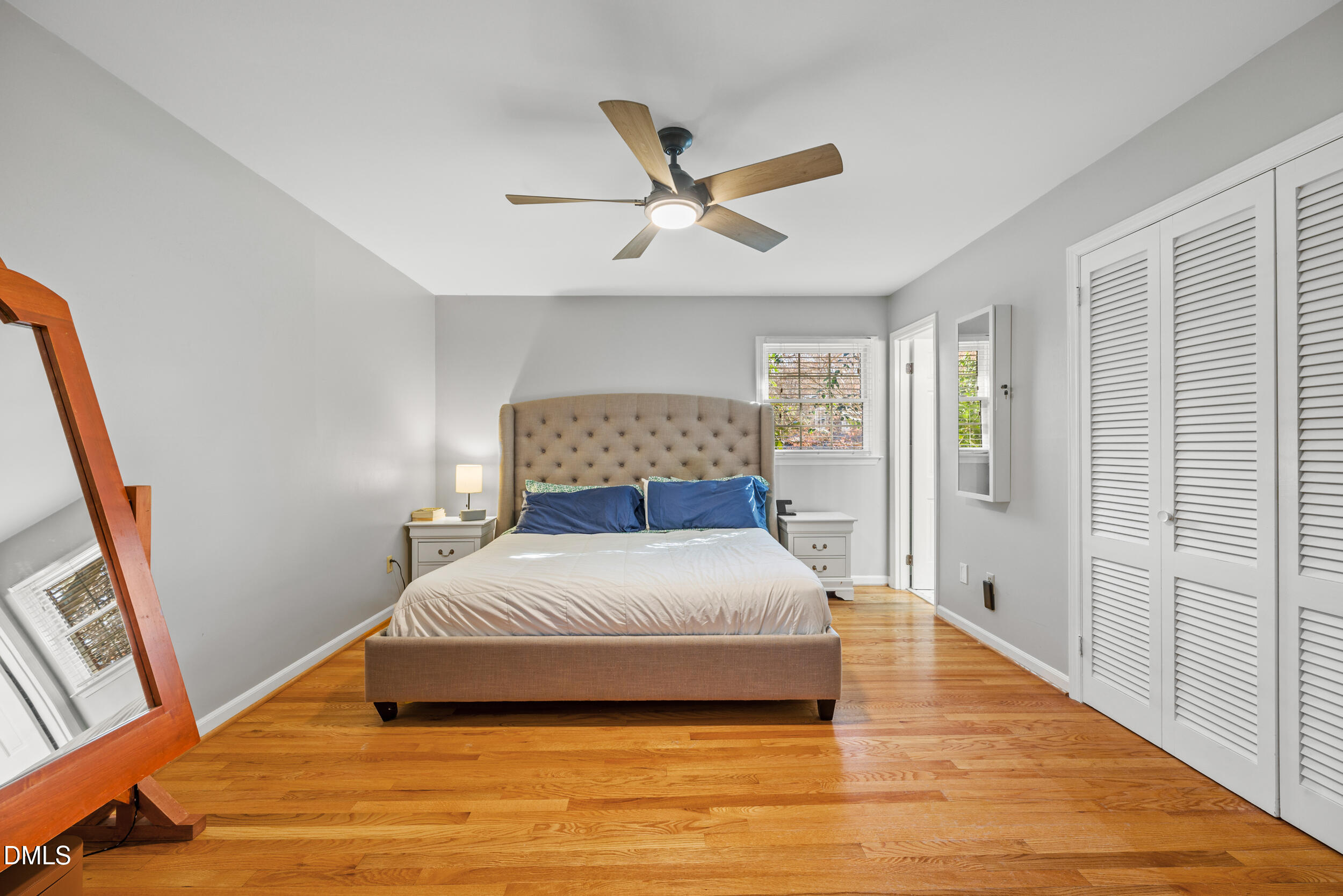 3726 Swift Drive Raleigh, NC 27606 - Photo 18 of 40 a bedroom with a bed and wooden floor